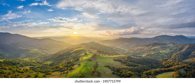 Forested hills in rising fog. Mountain sunset hills. - Shutterstock ID 1907715799