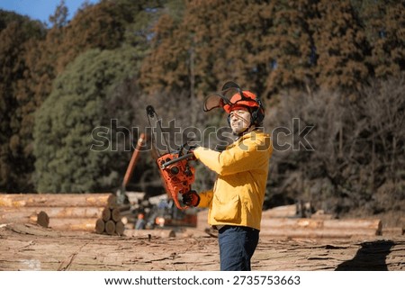 Forestry with chainsaws, an image of primary industries Cutting timber (Tama Timber Center Cooperative Property Permission Granted)	