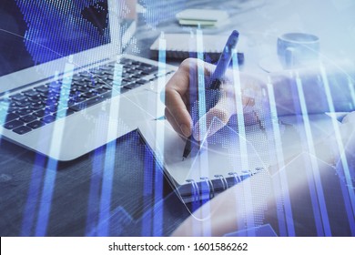 Forex chart displayed on woman's hand taking notes background. Concept of research. Multi exposure - Shutterstock ID 1601586262