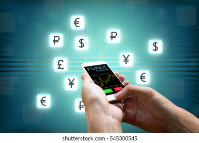 Forex Concept, Businessman Holding Smart Phone And Currency Icon.