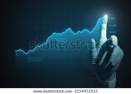 Forex market growth and business investing concept with man finger on digital touch screen with trading diagram and graphs on dark background