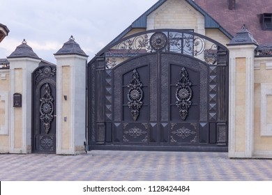 Forged Black Swing Gates In The Cottage