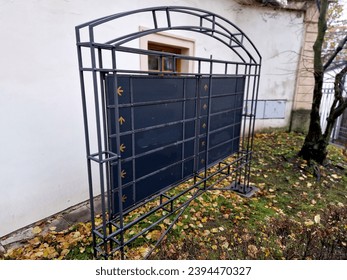 forged structure made of gray pipes in the shape of an arch and actually a trellis. Inside the frame is a signpost with arrows where you can add inscriptions of companies, institutions, houses or  - Powered by Shutterstock