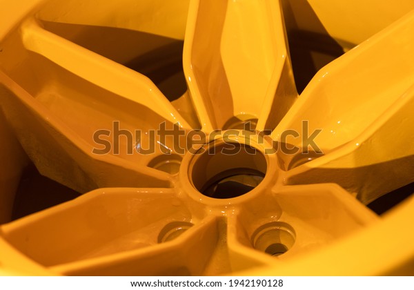 Forged yellow sports car rim, close up photo.\
Abstract modern car design\
template