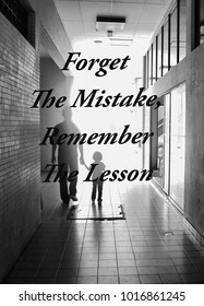 Forget The Mistake , Remember The Lesson text on black and white background.