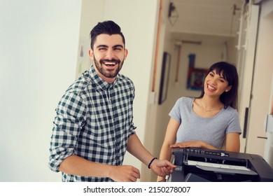 Forget The Water Cooler, The Copier Is The Gathering Place. Portrait Of A Young Businessman Using A Photocopy Machine In A Modern Office.