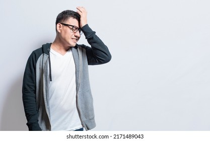A forgetful person touching his head, A person with trouble remembering isolated, Concept of a forgetful person, People with memory problems isolated - Shutterstock ID 2171489043