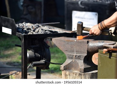 forging damascus steel by hand on the anvil 