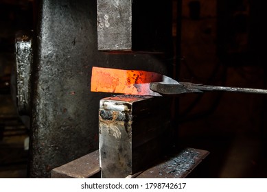 Forging molten metal. Making knives. - Powered by Shutterstock