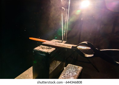 Forging molten metal. Making knives. - Powered by Shutterstock