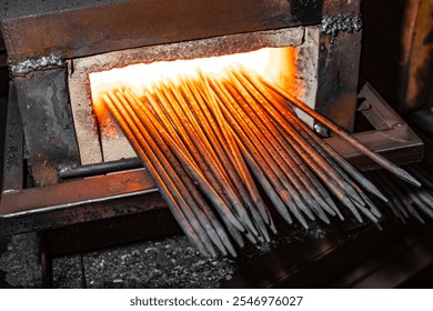 Forging Transformation: Intense Heat Ignites Metal Rods in the Heart of the Furnace, Unleashing a Dance of Fire and Strength. - Powered by Shutterstock