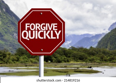 Forgive Quickly red sign with a landscape background