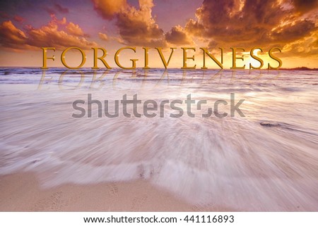 FORGIVENESS word in dramatic sunset at clean beach with slow shutter lanscape, seascape 
