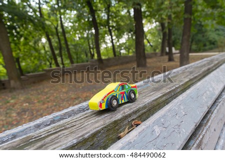 Forgotten children's toy on a bench in the park.