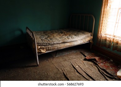  Forgotten, old, rusty, dirty mattress. Natural light.                                                             