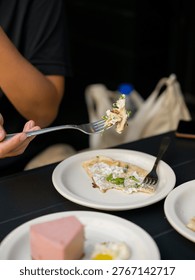 Fork with Creamy Flatbread Bite Pink Cheesecake in Foreground
