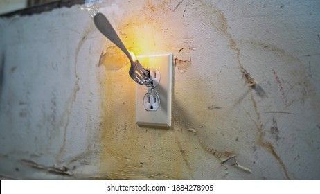 Fork Getting Zapped In Electrical Outlet