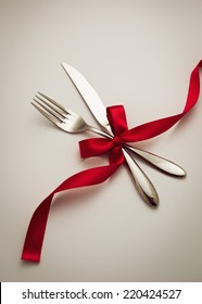 Fork And Knife With Decorative Ribbon.