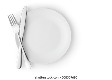 Fork and knife on a empty plate