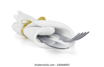 Fork And Knife In A White Napkin With A Bow Isolated On White