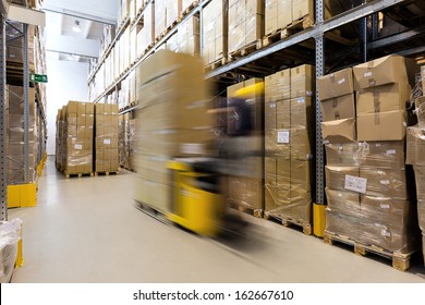 Fork lift operator preparing products for shipment
