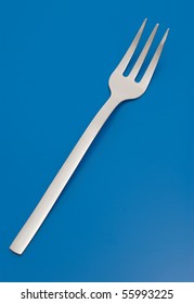 Fork For Meat Carving Isolated On The Blue Background.