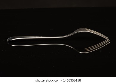 Fork On A Black Shinny Floor