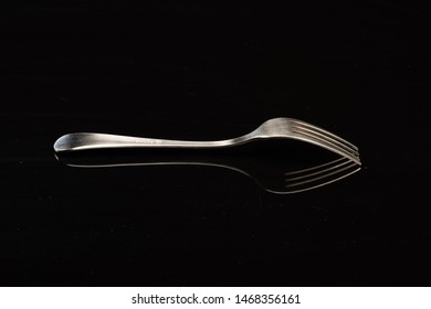 Fork On A Black Shinny Floor