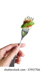 Fork With Pasta And Basil In Hand