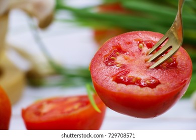 fork is picking tomato