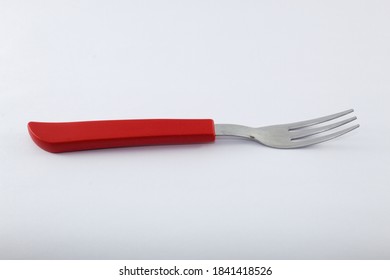 Fork with red handle and white background - Powered by Shutterstock