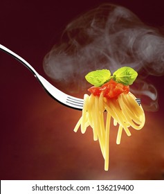 Fork With Spaghetti Tomato And Basil