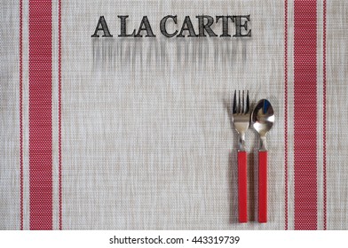 Fork and spoon on table liner with 'A La Carte' words.
