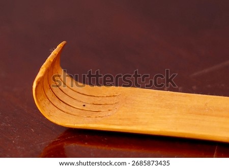 The forked end of a back scratcher                               