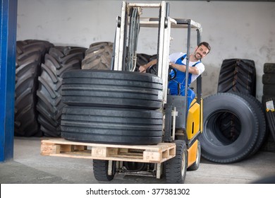 Forklift Carries Sell Car Tires In Tire Store