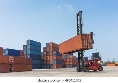 Forklift Handling Container Box In Import, Export, Logistics Area With Empty Sky For Add Some Text, Logo, Image, Etc.