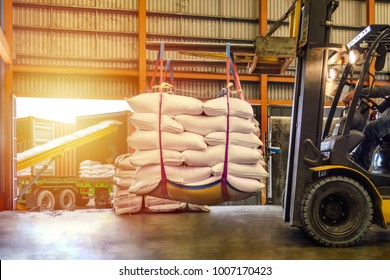 Forklift Handling White Sugar Bags For Stuffing Into Containers Outside A Warehouse. Distribution, Logistics Import Export, Warehouse Operation, Trading, Shipment, Delivery Concept.