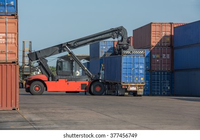 Forklift lifting container 40 feet from the truck .