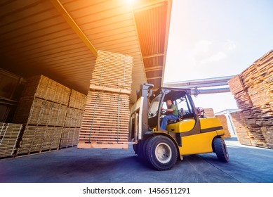 Forklift Loader Load Lumber Into A Dry Kiln. Wood Drying In Containers. Industrial Concept