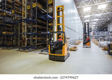 Forklift loader in Modern warehouse interior with shelves and boxes. - Powered by Shutterstock