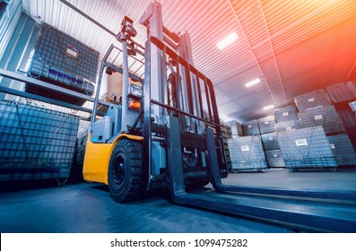 Forklift loader. Pallet stacker truck equipment at warehouse. Background