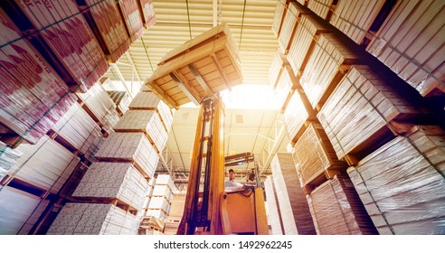 Forklift Loader In Storage Warehouse Ship Yard. Distribution Products. Delivery. Logistics. Transportation. Business Background