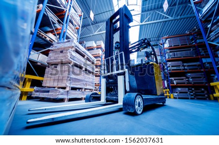 Forklift loader in storage warehouse ship yard. Distribution products. Delivery. Logistics. Transportation. Business background