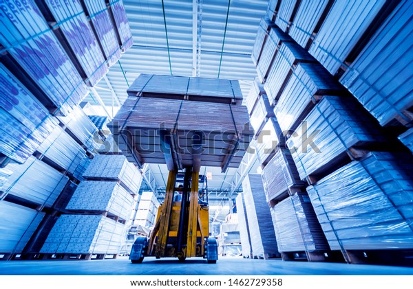 Forklift loader in storage warehouse ship\
yard. Distribution products. Delivery. Logistics. Transportation.\
Business background