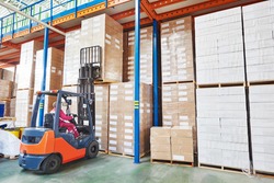 forklift loader working in warehouse, an Industrial Photo by Dmitry Kalinovsky