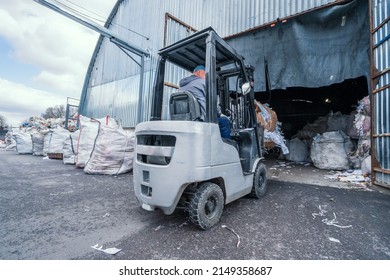 Forklift Loading Stack Of Paper And Wastepaper Into A Paper Recycling Facility