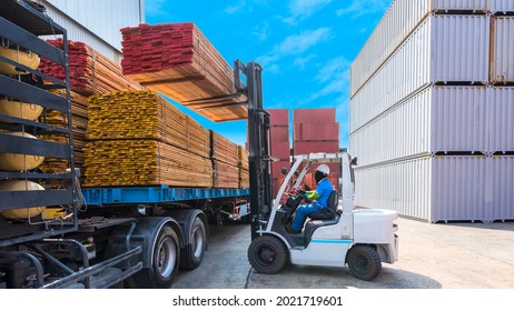 Forklift Operator Handling Wooden Pallets In Port