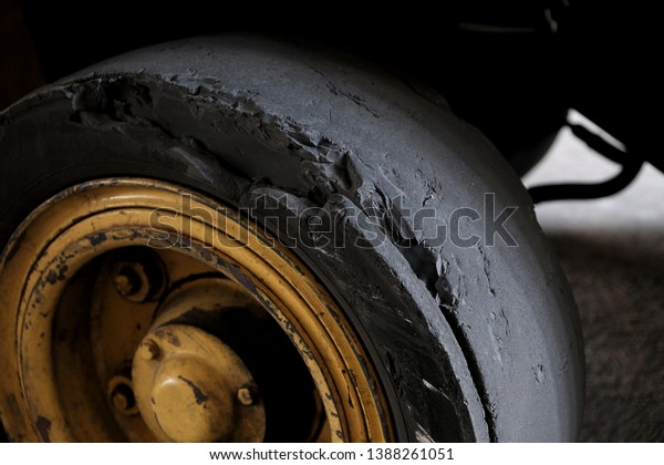 Forklift tires in the factory With torn tire\
condition and not safe to\
use.
