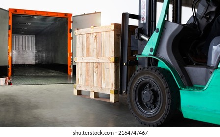 Forklift Tractor Loading Wooden Crate Boxes Into Cargo Container. Shipping Trucks. Delivery Cargo Service. Supply Chain Goods Shipment. Warehouse Logistics Transport.