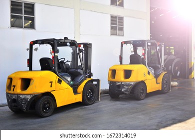 Forklift Transport Cargo In Front Of The Warehouse.